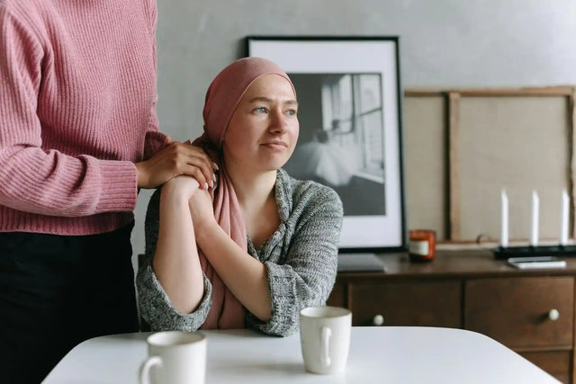 A patient and supporter discussing cancer signaling pathways and treatment options